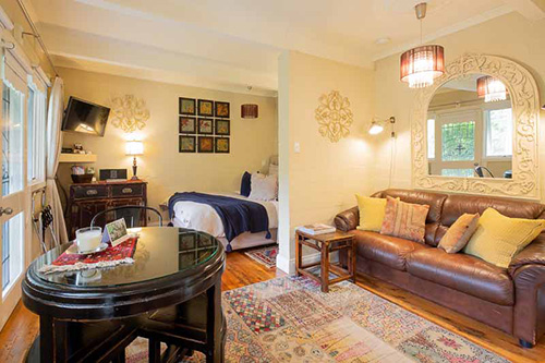 a living room filled with furniture and a fireplace
