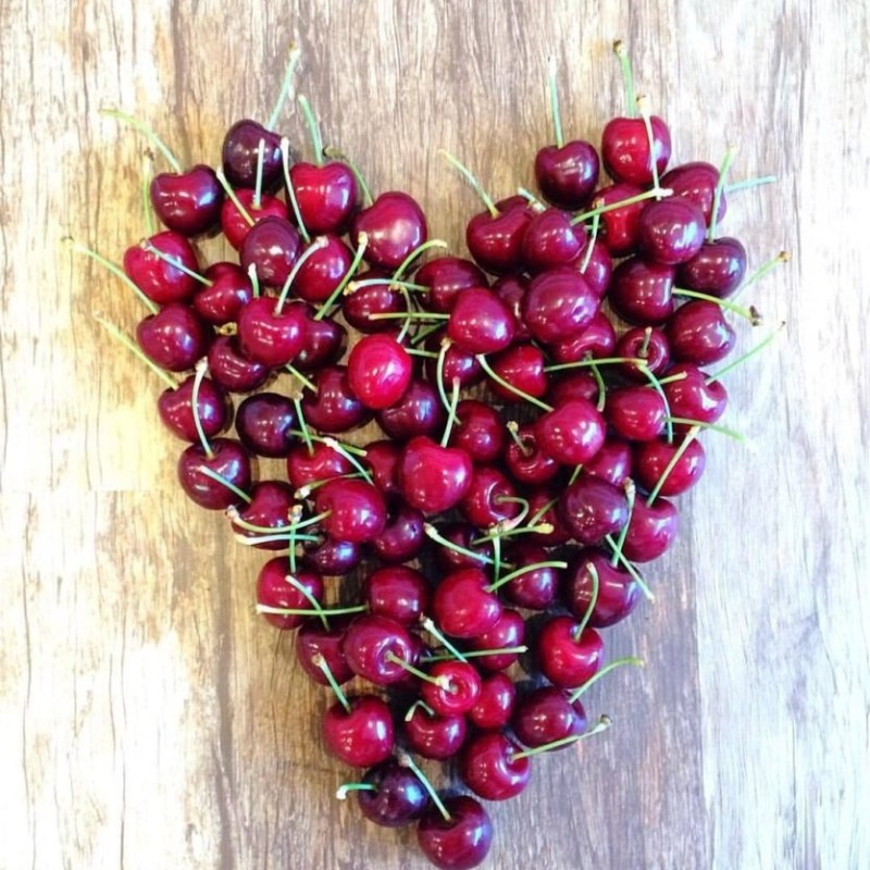 a bunch of fruit sitting on top of a wooden table