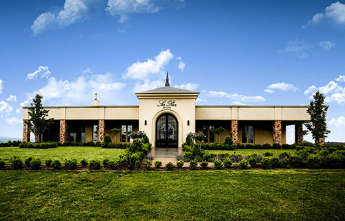 a large clock tower sitting in the grass